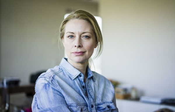 Portrait of blond businesswoman wearing denim shirt