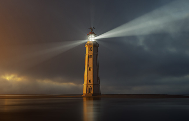 lighthouse at sunset with light rays